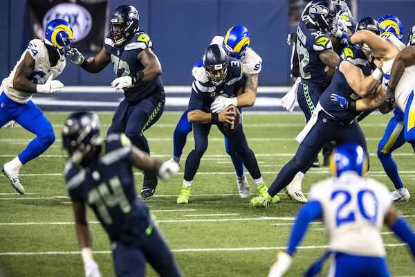 DE Morgan Fox sacke QB Russell Wilson